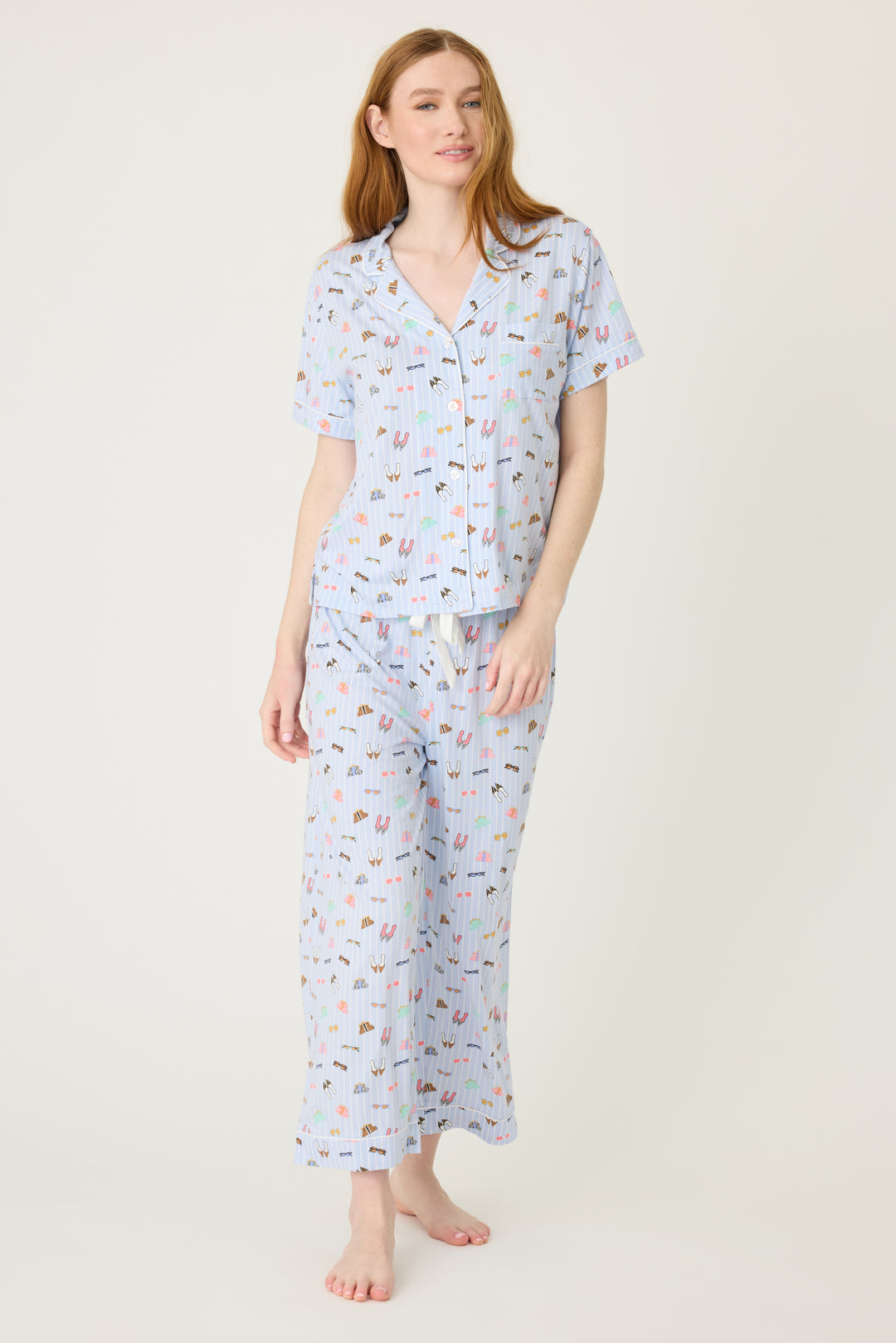 Women's breathable cotton-modal jersey short sleeve pajama set in light blue fashion shoe print. With blue contrast piping & tie. Button-front top & open leg pant.