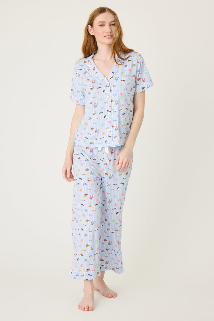 Women's breathable cotton-modal jersey short sleeve pajama set in light blue fashion shoe print. With blue contrast piping & tie. Button-front top & open leg pant.