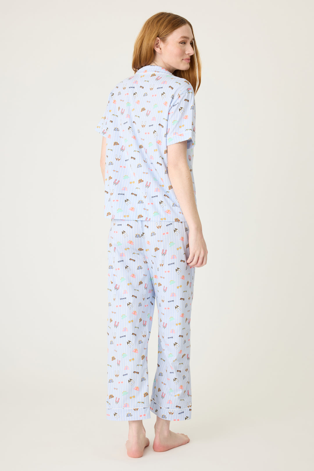 Women's breathable cotton-modal jersey short sleeve pajama set in light blue fashion shoe print. With blue contrast piping & tie. Button-front top & open leg pant.