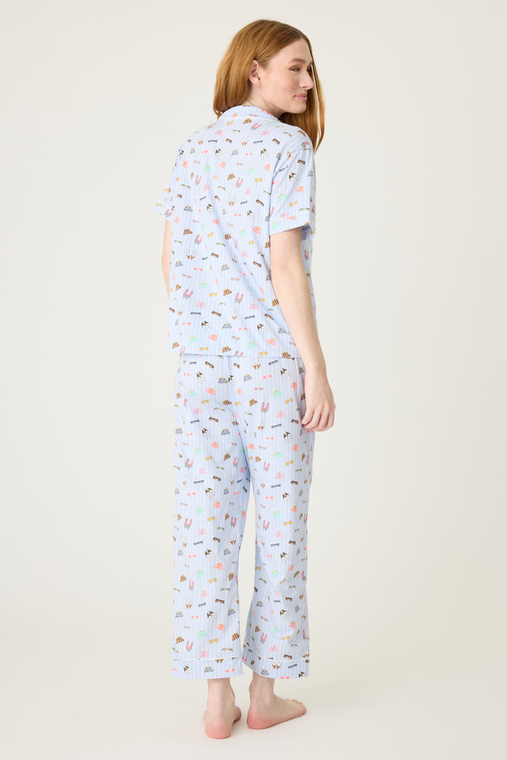 Women's breathable cotton-modal jersey short sleeve pajama set in light blue fashion shoe print. With blue contrast piping & tie. Button-front top & open leg pant.