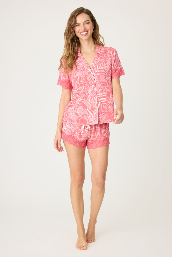 Pink floral modal women's pajama short set with scallop lace hem. Short sleeve button-front top with lace-trim sleeves. Contrast tie waistband.