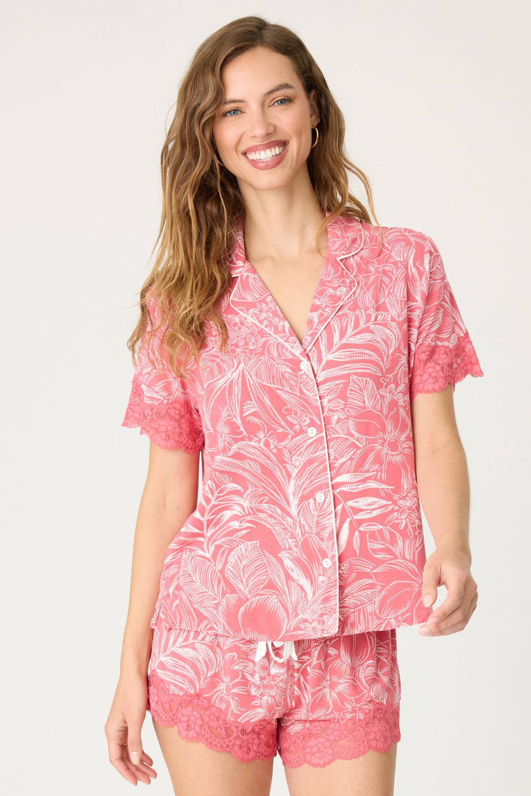 Pink floral modal women's pajama short set with scallop lace hem. Short sleeve button-front top with lace-trim sleeves. Contrast tie waistband.