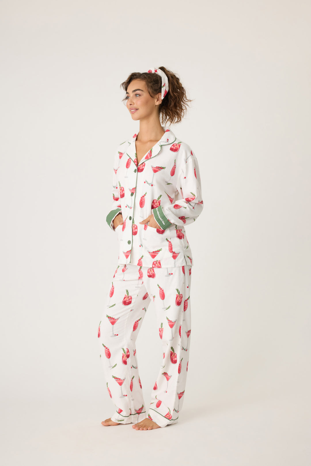 Women's cotton flannel pajama set in ivory & festive red cocktail print. Button-front collared top & tie-waist pant. Embroidered sleeve cuff "Warm Wishes & Cocktail Kisses". Includes matching hair wrap.
