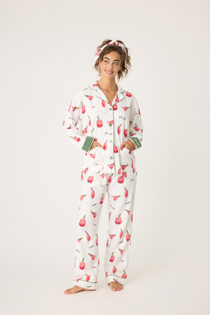 Women's cotton flannel pajama set in ivory & festive red cocktail print. Button-front collared top & tie-waist pant. Embroidered sleeve cuff "Warm Wishes & Cocktail Kisses". Includes matching hair wrap.