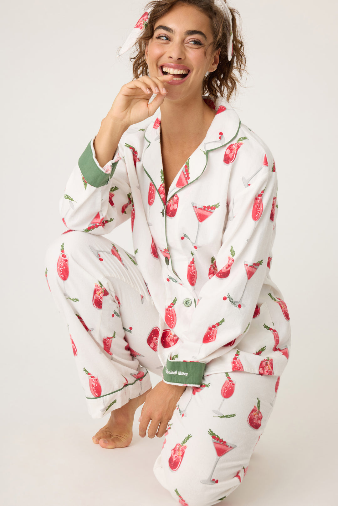 Women's cotton flannel pajama set in ivory & festive red cocktail print. Button-front collared top & tie-waist pant. Embroidered sleeve cuff "Warm Wishes & Cocktail Kisses". Includes matching hair wrap.