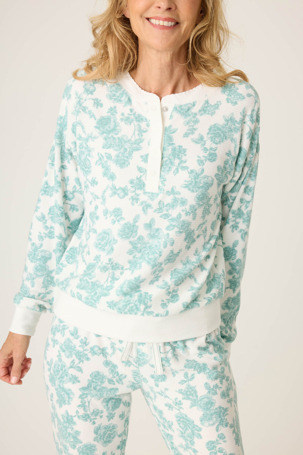 Women's white pj jammie top and banded jogger pant with jade floral pattern.