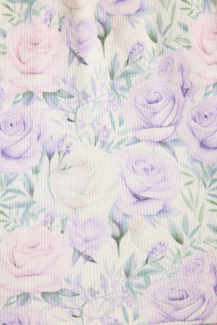 Women's lilac rose patterned collared pj long sleeve and tie waist pants.