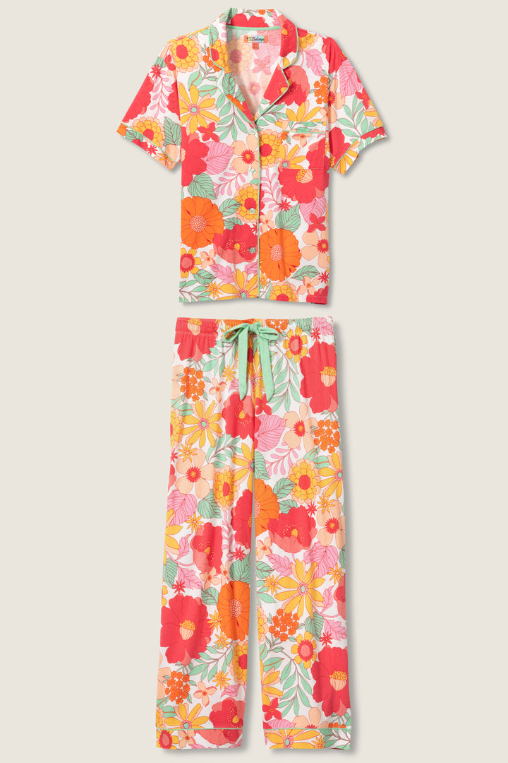 Women's breathable cotton-modal jersey short sleeve pajama set in coral-orange yellow floral print. With aqua contrast piping & tie. Button-front top & open leg pant.