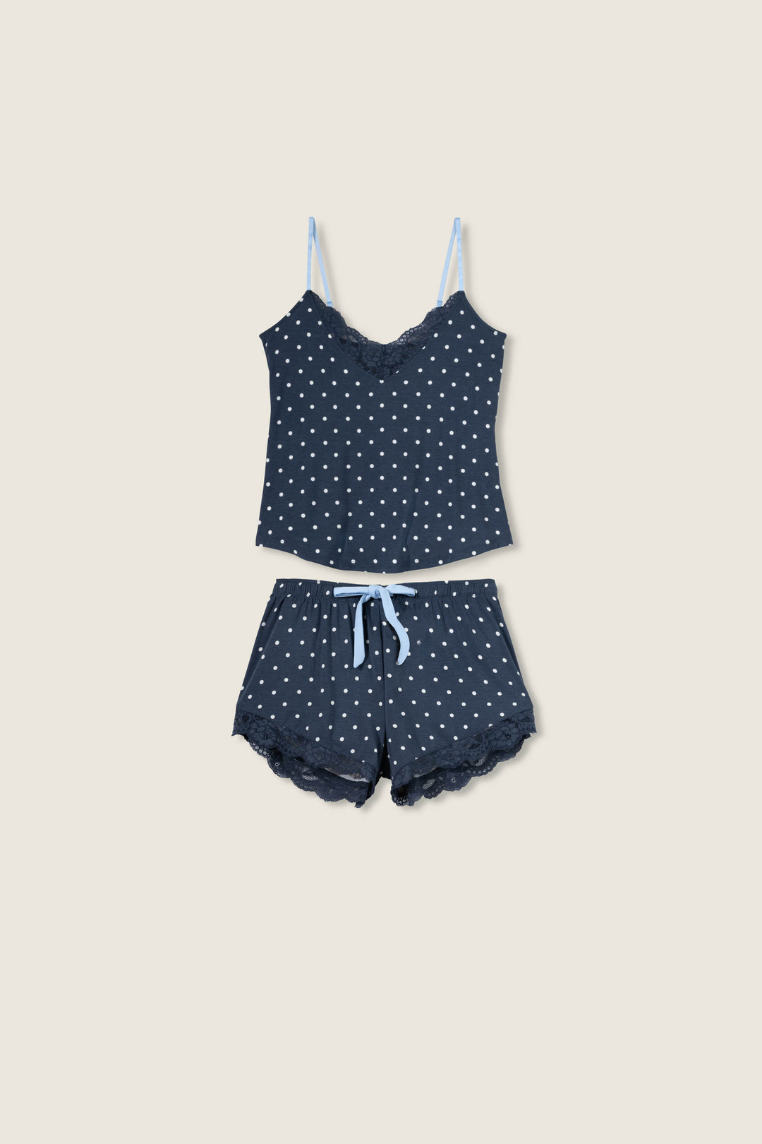 Women's navy blue w/ivory polka dot camisole & short sleep set in modal jersey. Cami has adjustable straps & lace inset neckline. Short has contrast tie-waist & lace hem.