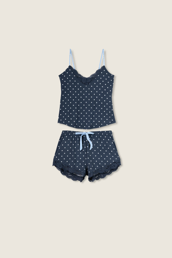 Women's navy blue w/ivory polka dot camisole & short sleep set in modal jersey. Cami has adjustable straps & lace inset neckline. Short has contrast tie-waist & lace hem.