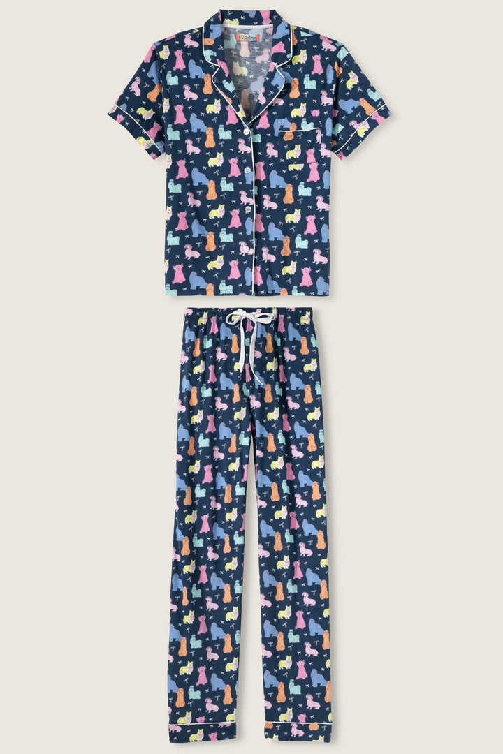 Women's breathable cotton-modal jersey short sleeve pajama set in navy w/pastel dog print with contrast ivory piping. Button-front top & open leg tie-waist pant.