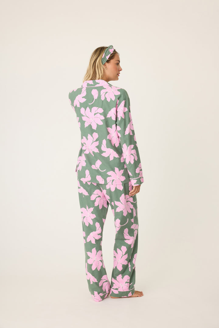 Women's cotton flannel pajama set in green & pink poinsettia print. Button-front collared top & tie-waist pant. Embroidered sleeve cuff "Find Peace Within". Includes matching hair wrap.