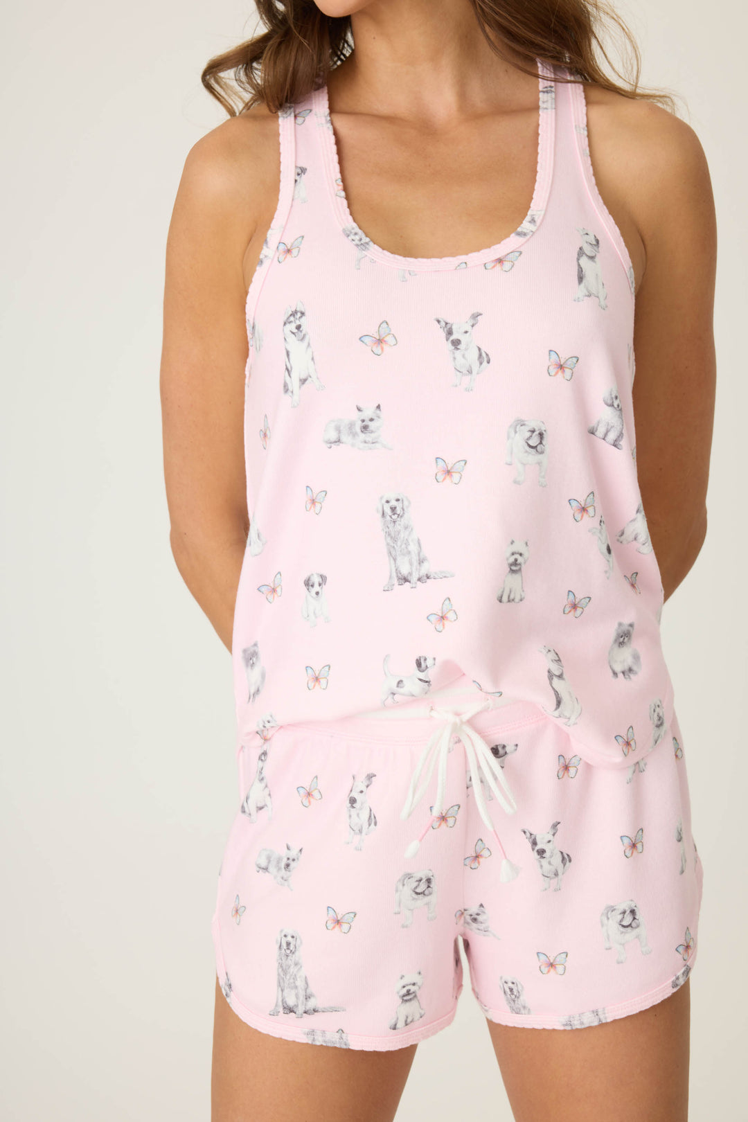 Pink dog-printed sleep set for women. Racer back sleep tank & open leg lounge pant with tie waist.