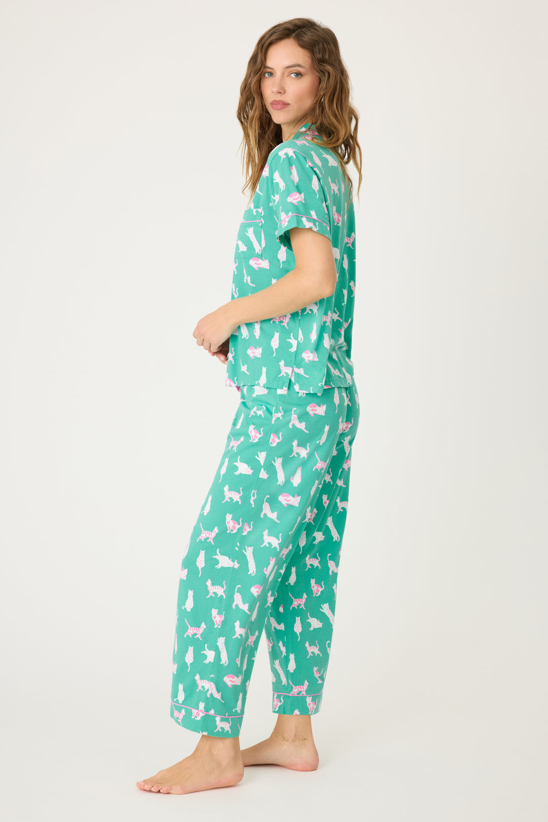 Women's breathable cotton-modal jersey short sleeve pajama set in teal with cats print. With pink contrast piping & tie. Button-front top & open leg pant.