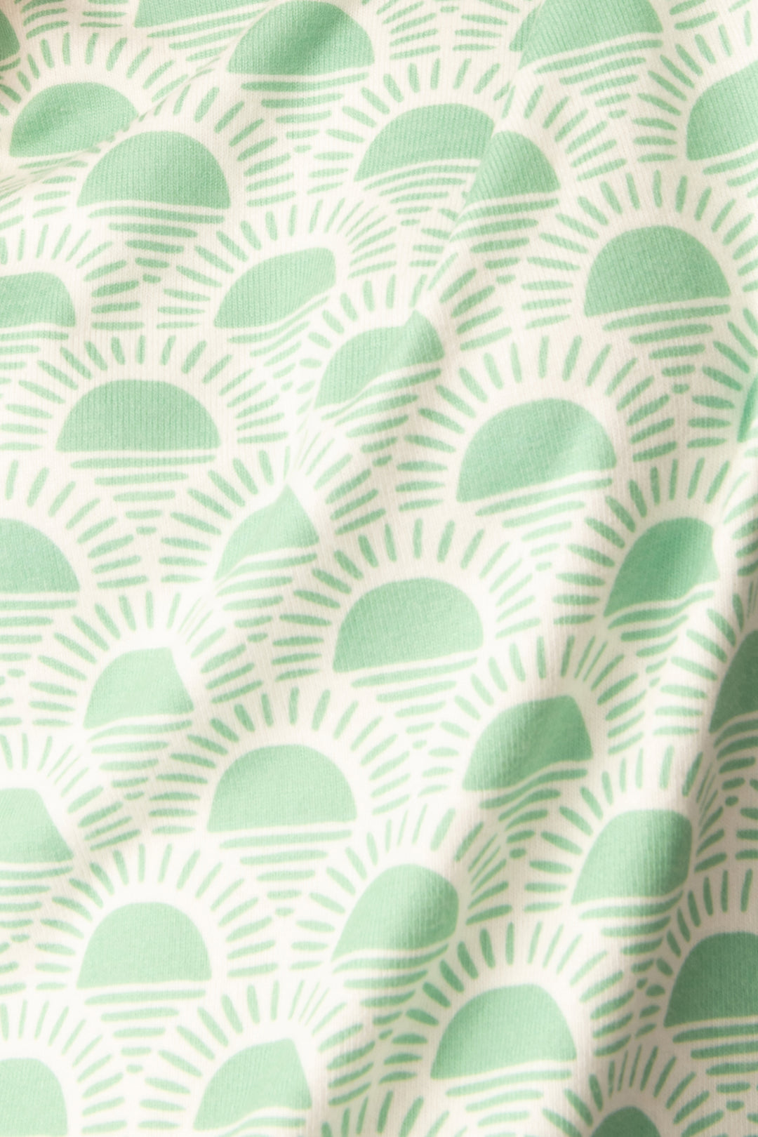 Women's lounge set in racket-sun printed peachy in ivory-green pattern, with pink & green stripe details.