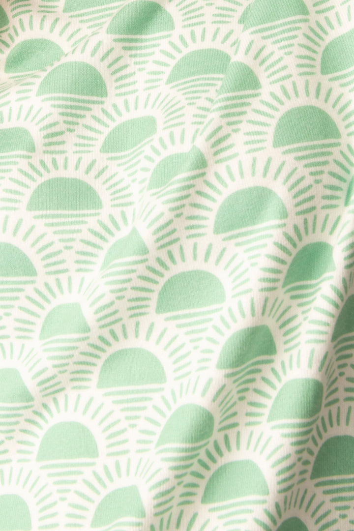 Women's lounge set in racket-sun printed peachy in ivory-green pattern, with pink & green stripe details.