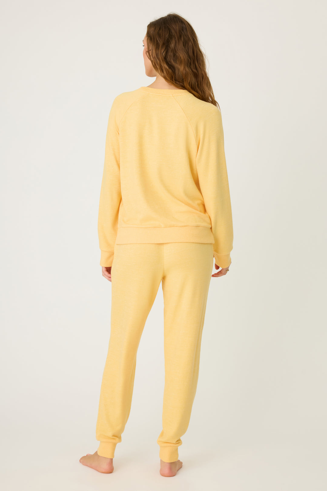 Women's sun yellow lounge set top & jogger with small floral embroidery on cuff.