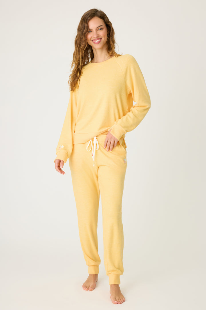 Women's sun yellow lounge set top & jogger with small floral embroidery on cuff.