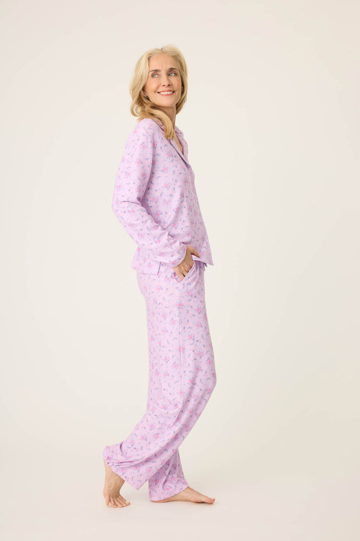 Women's classic pajama set with button-front notch collar top & tie waist pant.  Peachy jersey with lilac mini floral print.