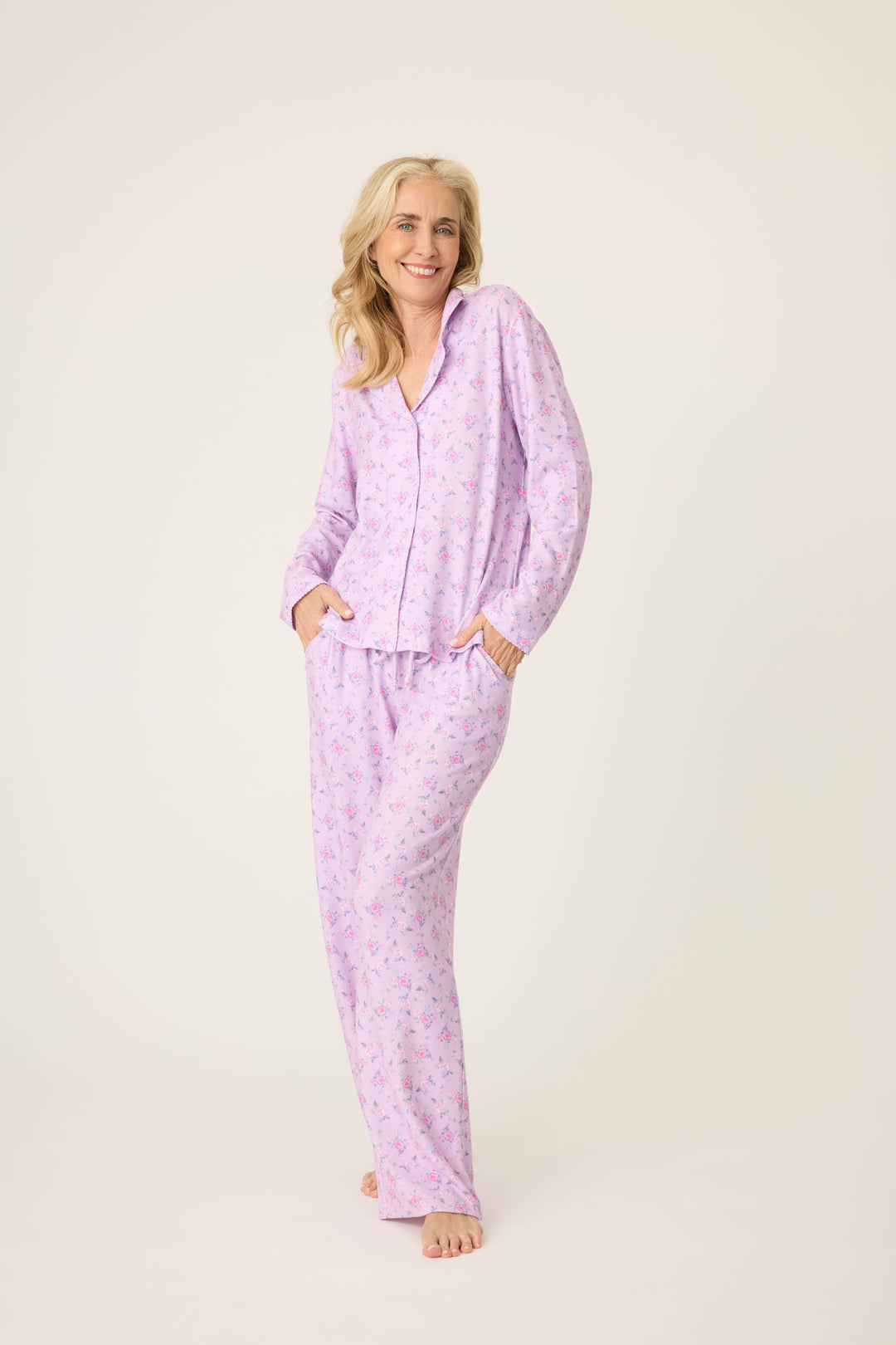 Women's classic pajama set with button-front notch collar top & tie waist pant.  Peachy jersey with lilac mini floral print.