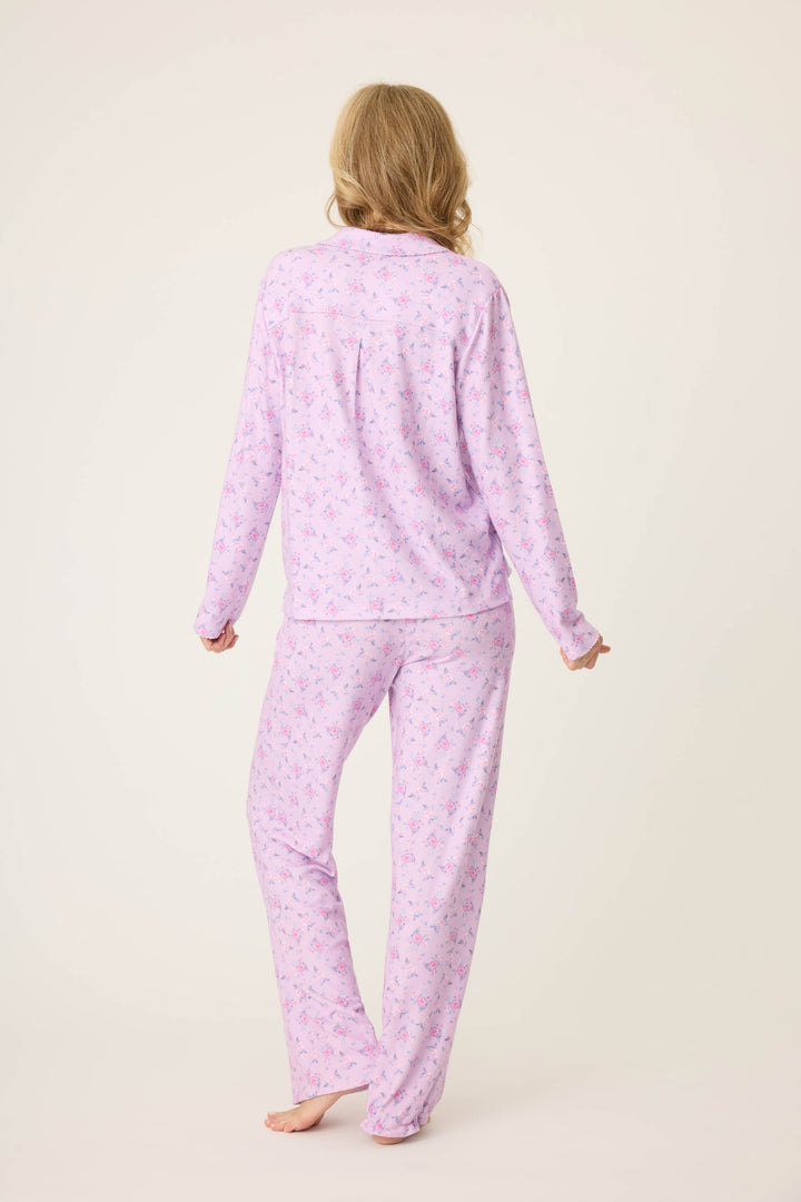 Women's classic pajama set with button-front notch collar top & tie waist pant.  Peachy jersey with lilac mini floral print.