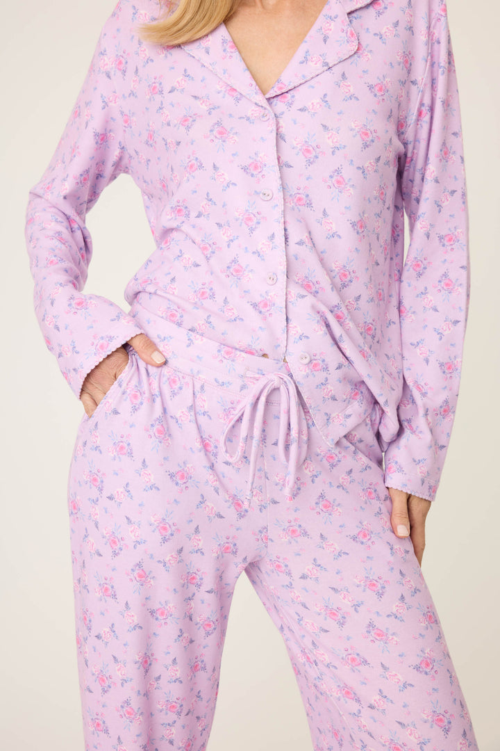Women's classic pajama set with button-front notch collar top & tie waist pant.  Peachy jersey with lilac mini floral print.