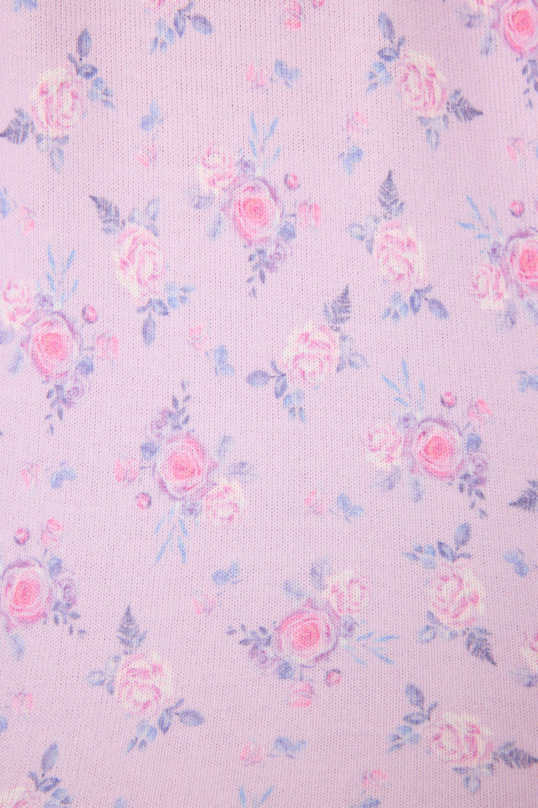 Women's classic pajama set with button-front notch collar top & tie waist pant.  Peachy jersey with lilac mini floral print.