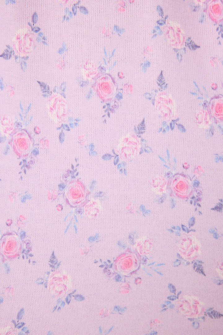 Women's classic pajama set with button-front notch collar top & tie waist pant.  Peachy jersey with lilac mini floral print.