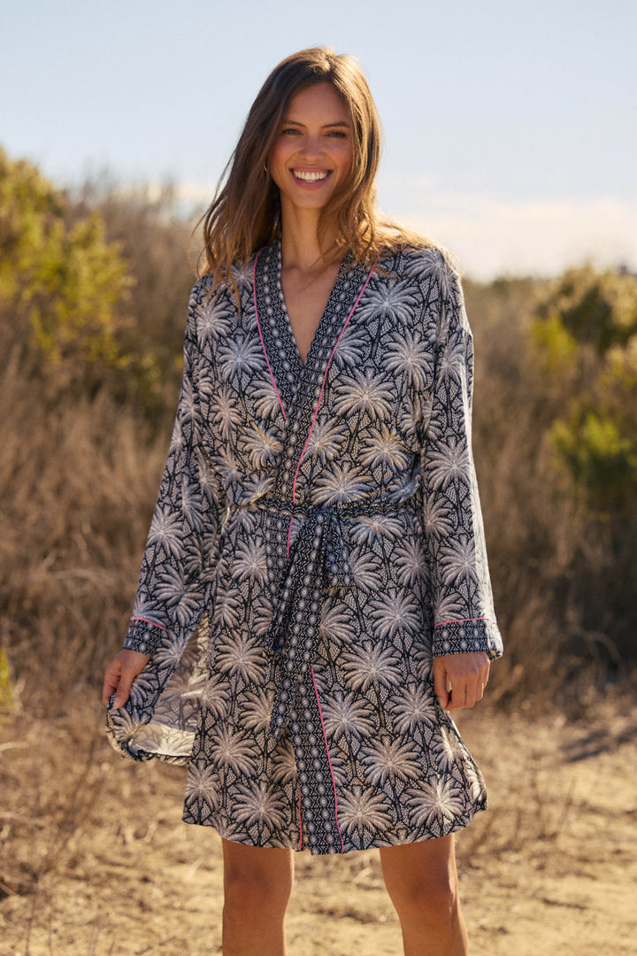 Women's black & ivory palm printed kimono-style robe in modal. With contrast pink piping. Midi length with self tie belt.