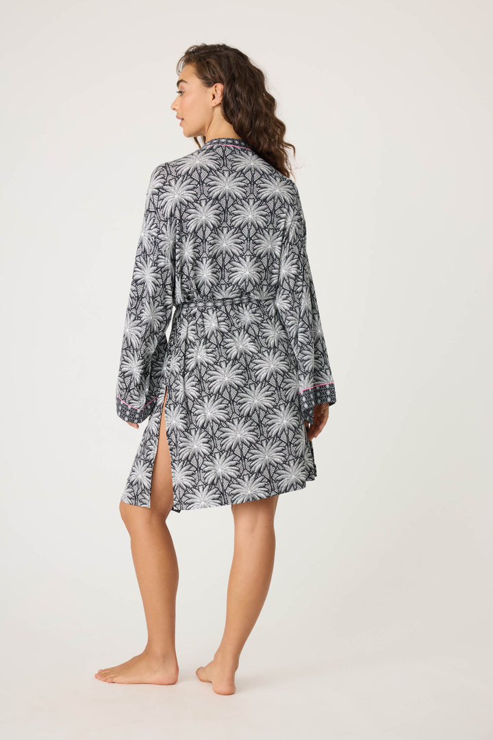 Women's black & ivory palm printed kimono-style robe in modal. With contrast pink piping. Midi length with self tie belt.