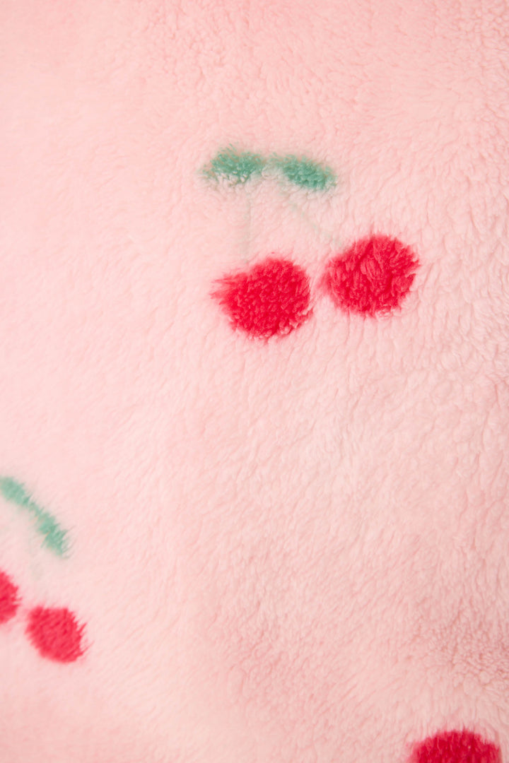 Women's pale pink plush robe with cherry pattern.