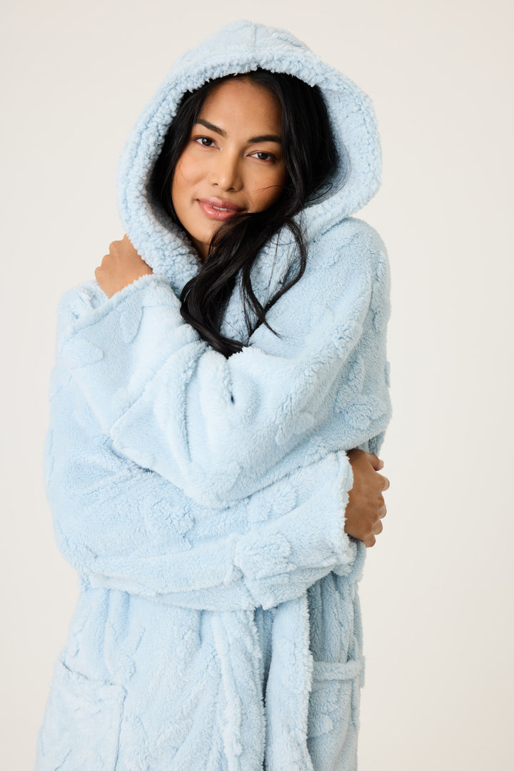 Women's cozy plush hooded robe in ice blue with embossed butterfly pattern.