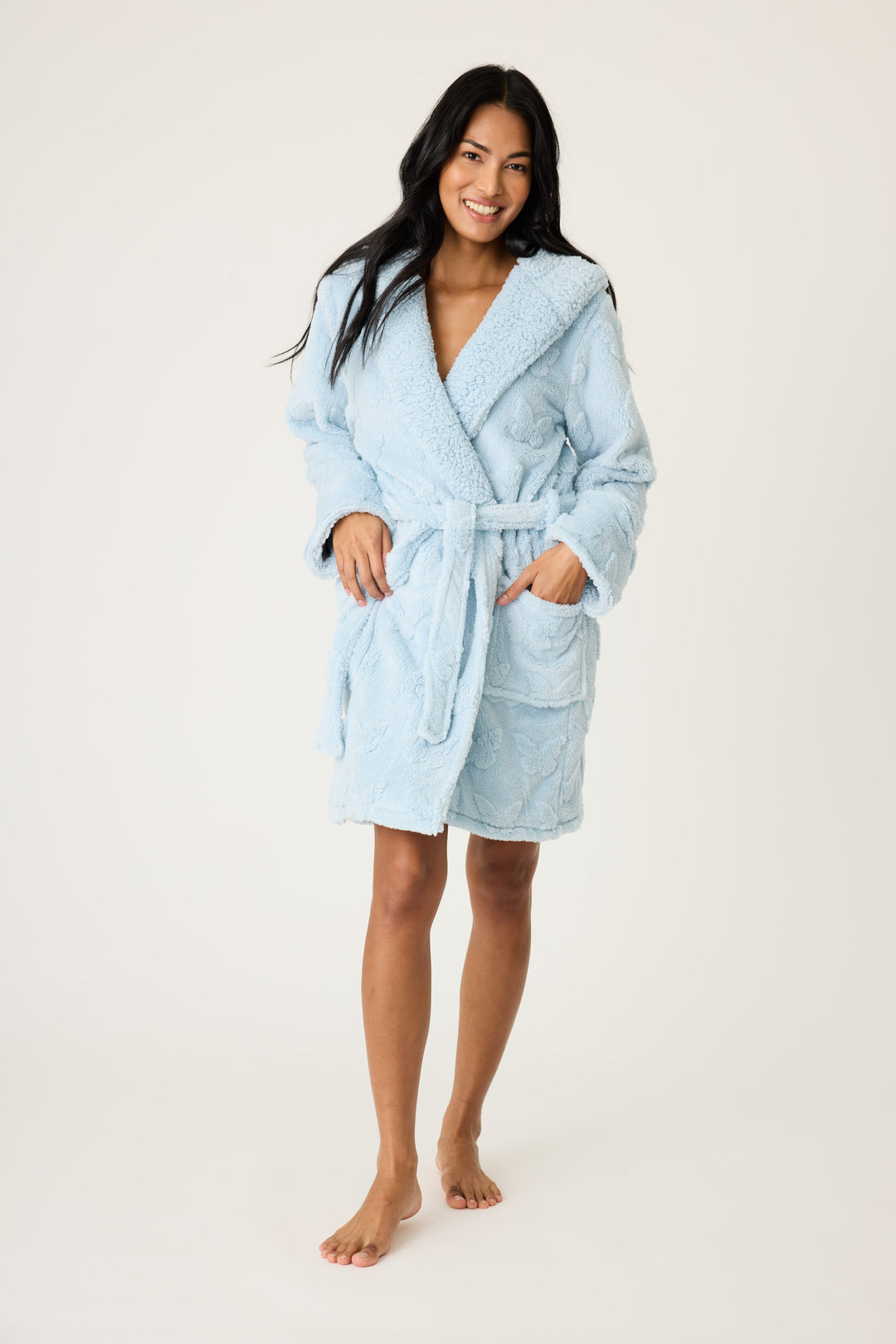 Women's cozy plush hooded robe in ice blue with embossed butterfly pattern.