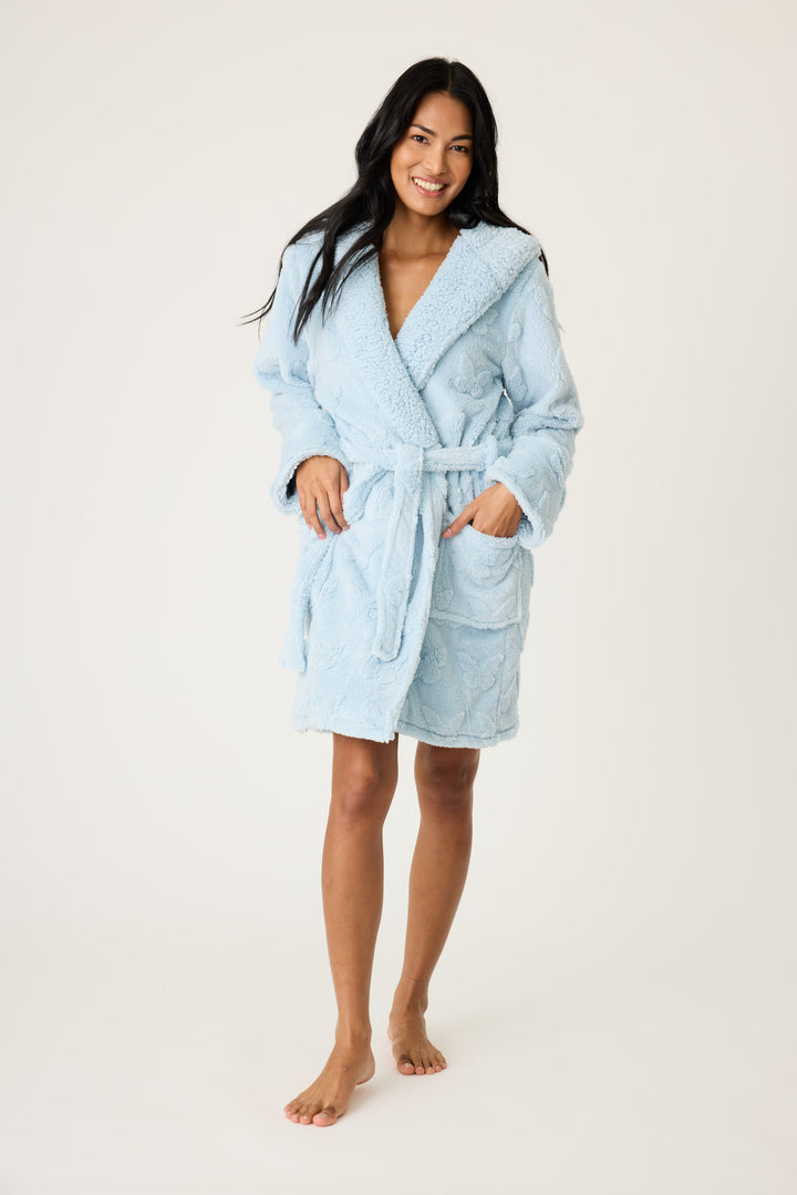Women's cozy plush hooded robe in ice blue with embossed butterfly pattern.