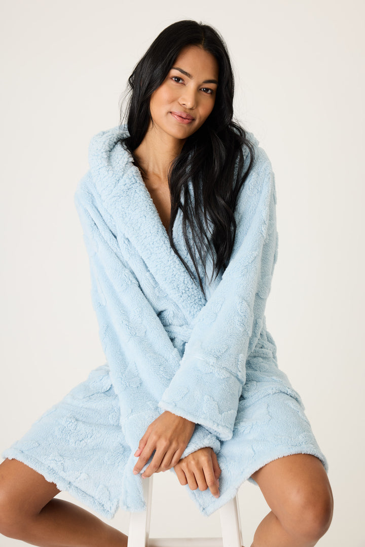 Women's cozy plush hooded robe in ice blue with embossed butterfly pattern.