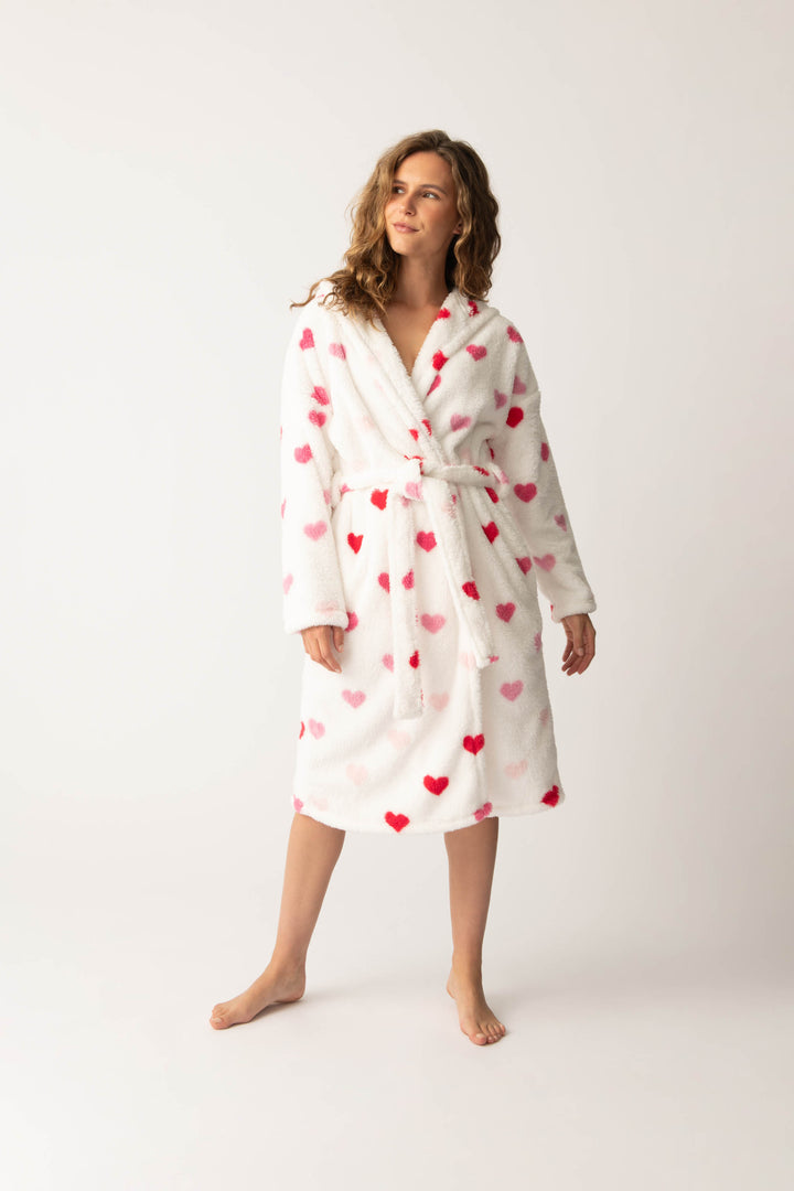 Women's plush white lounge robe with pink heart pattern.