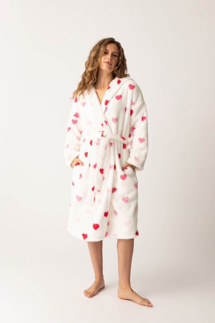 Women's plush white lounge robe with pink heart pattern.