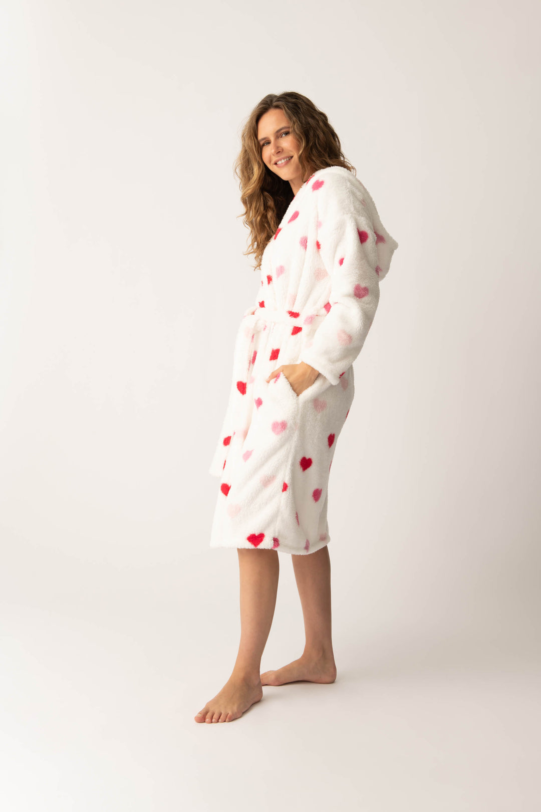 Women's plush white lounge robe with pink heart pattern.