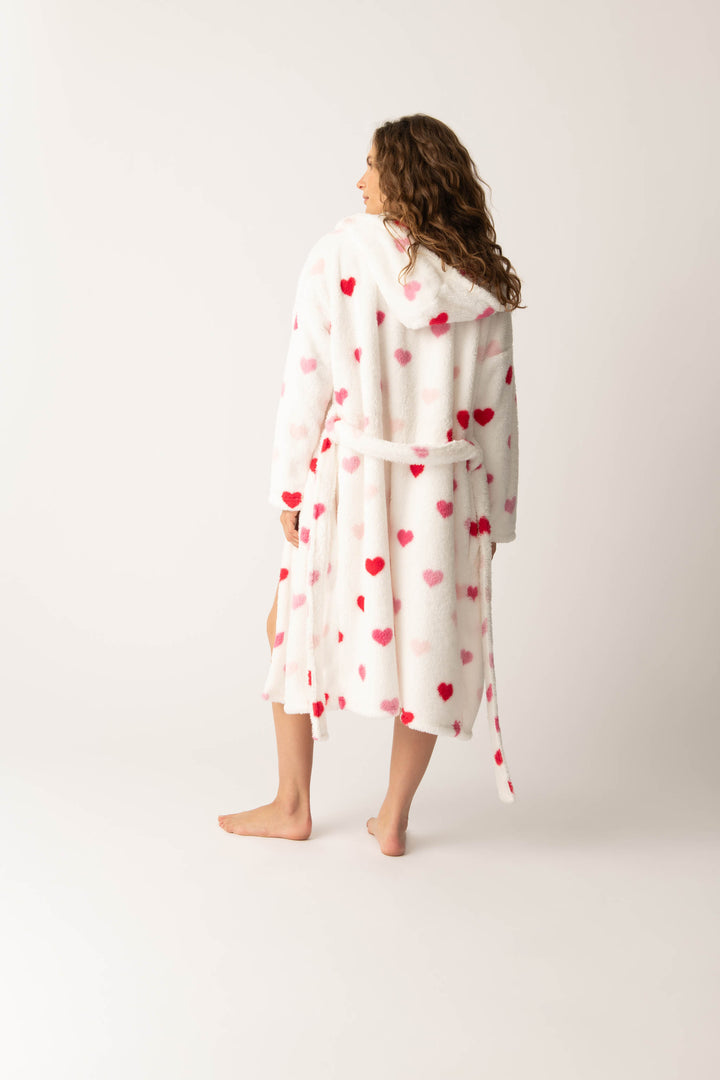 Women's plush white lounge robe with pink heart pattern.