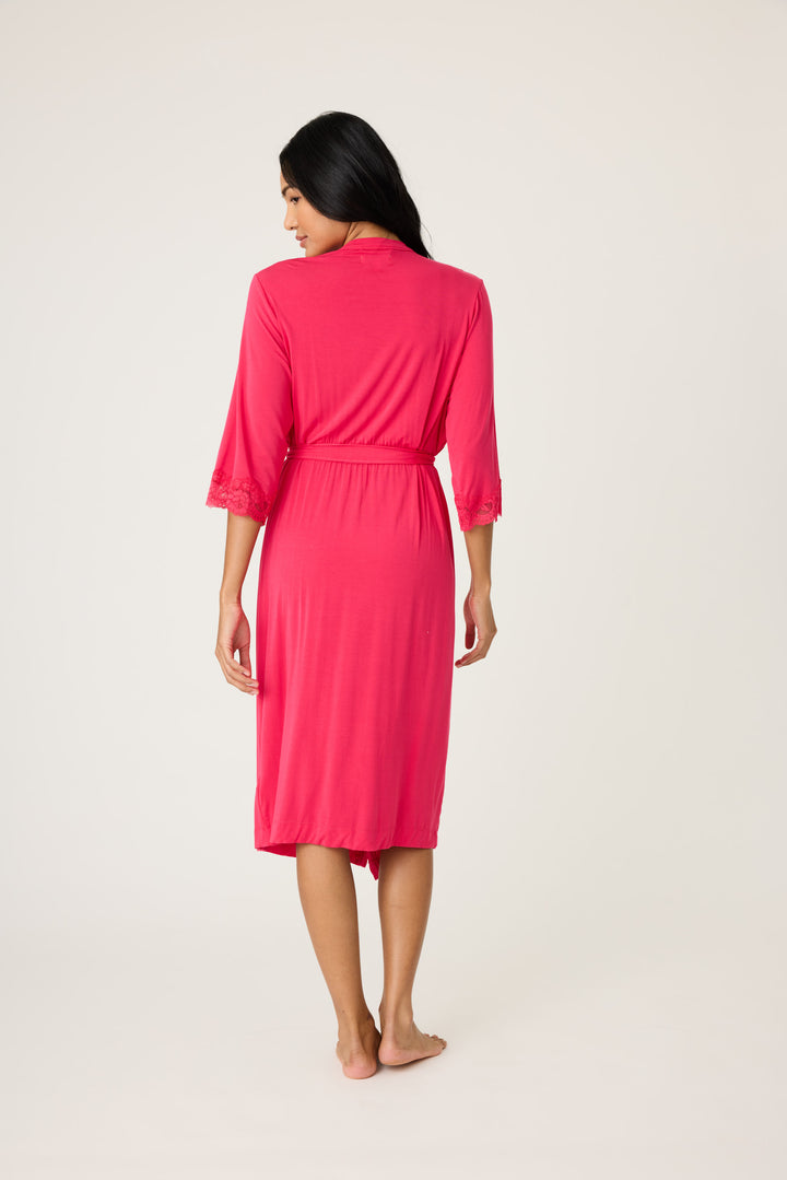 Women's hot pink lounge robe with lace detail on sleeves.