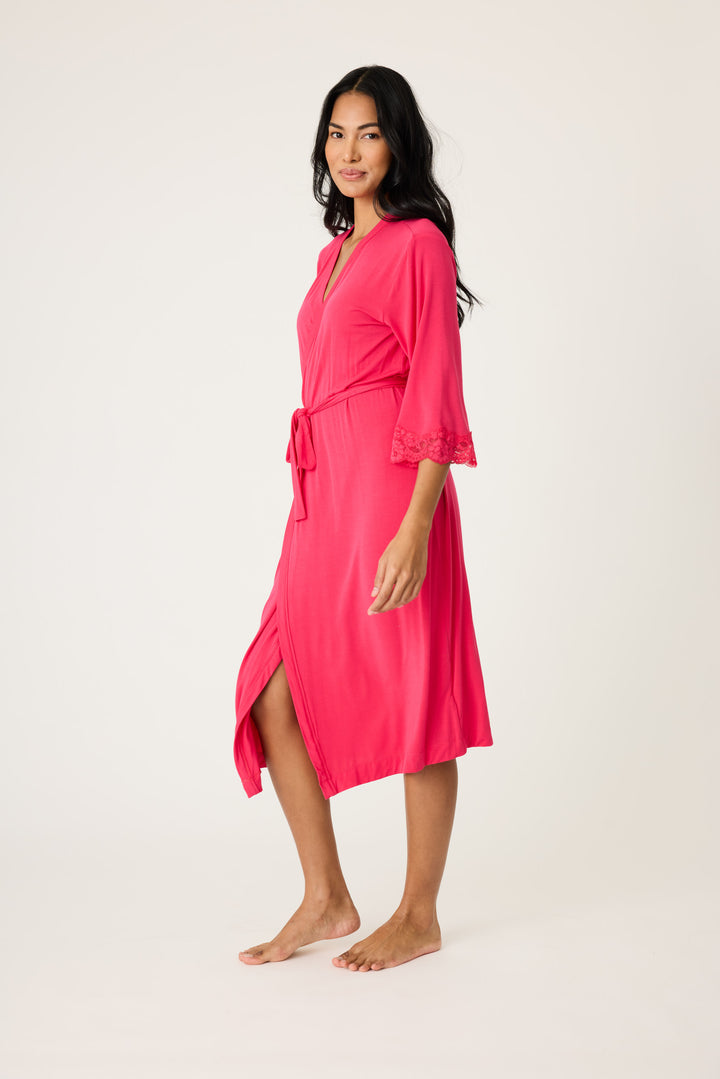 Women's hot pink lounge robe with lace detail on sleeves.