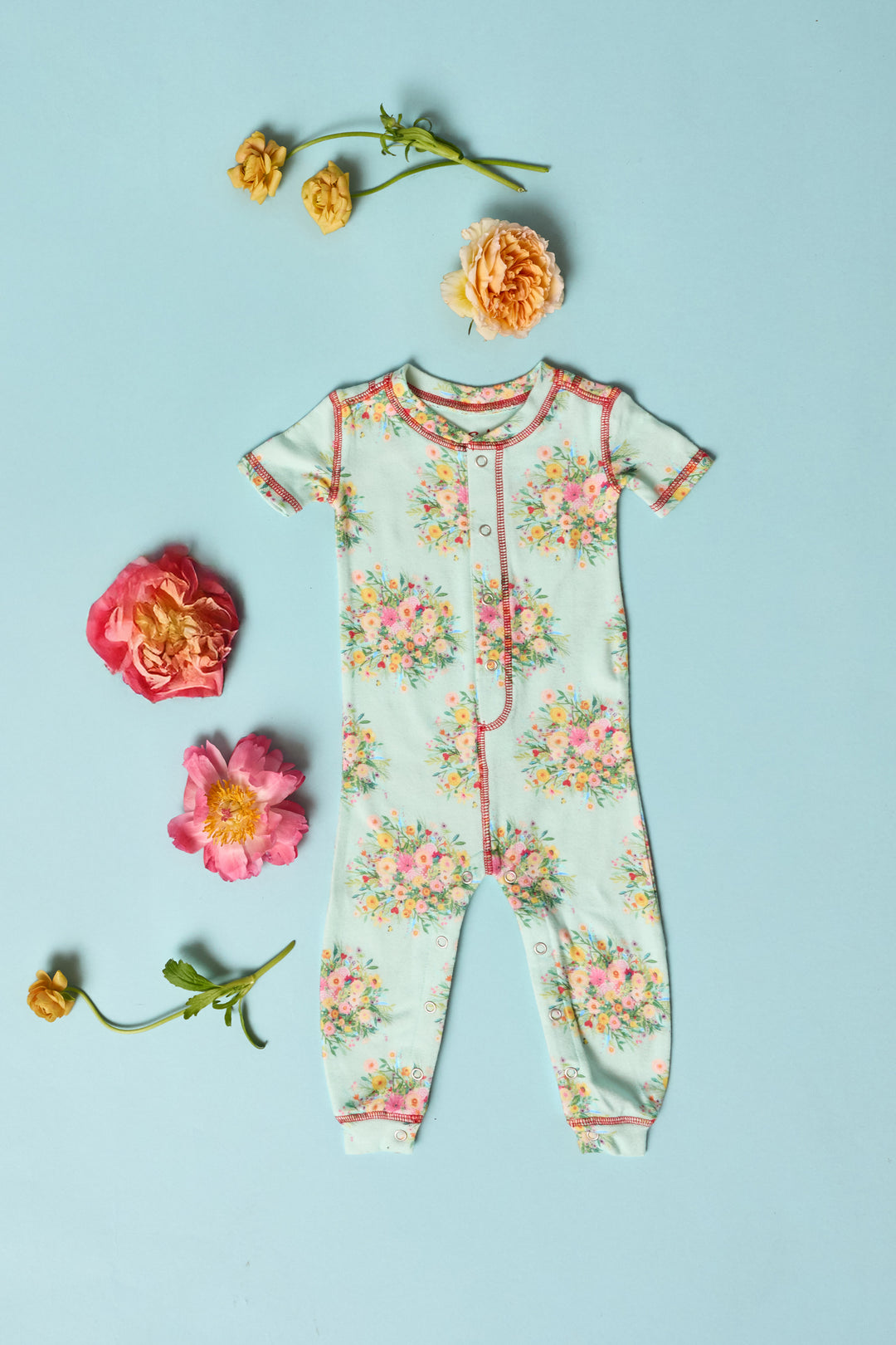 Exclusive collab wtih pop-culture artist Adrian Valencia. Infant onesie romper with front snaps.