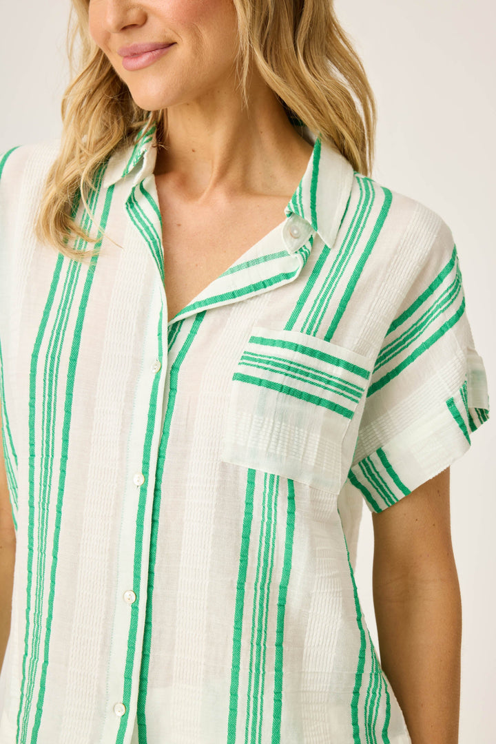 Women's green & white striped short sleeve button-front top in cotton woven gauze. With chest pocket & rounded hem.
