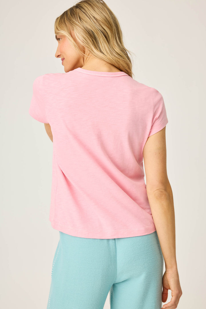 Women's pink short sleeve t-shirt with ALOHA floral graphic print.