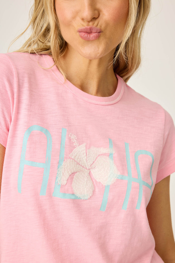 Women's pink short sleeve t-shirt with ALOHA floral graphic print.