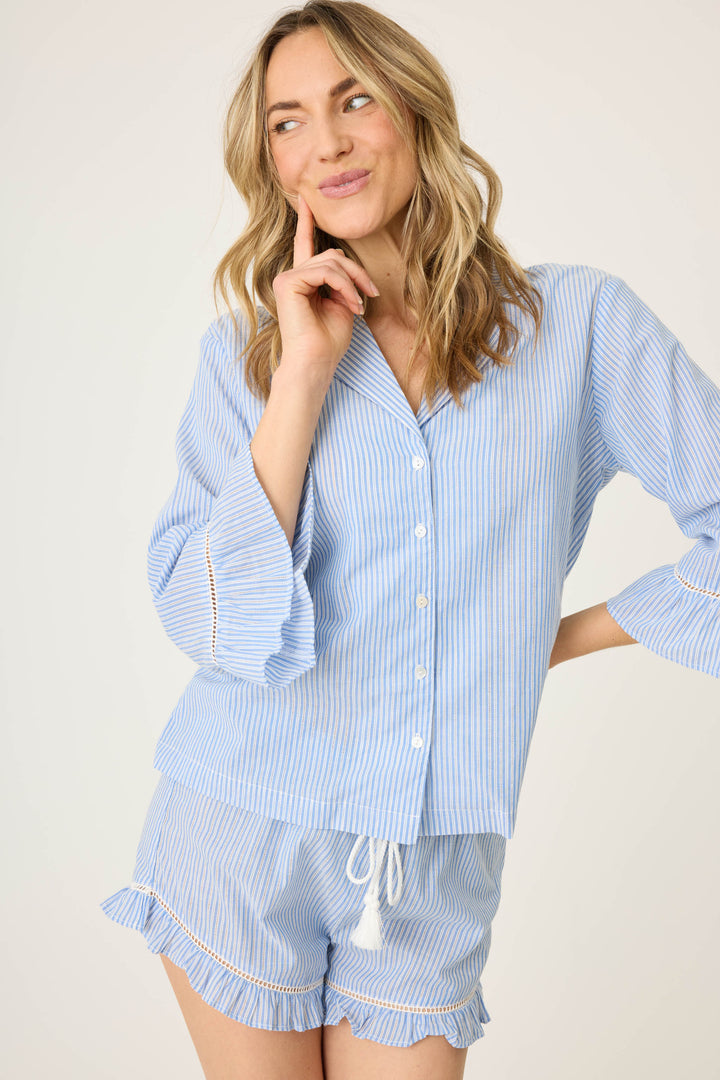 Women's blue & white striped sleep set. Cotton button front shirt with 3/4 ruffle sleeve. Short with ruffle hem & tassel tie waist.