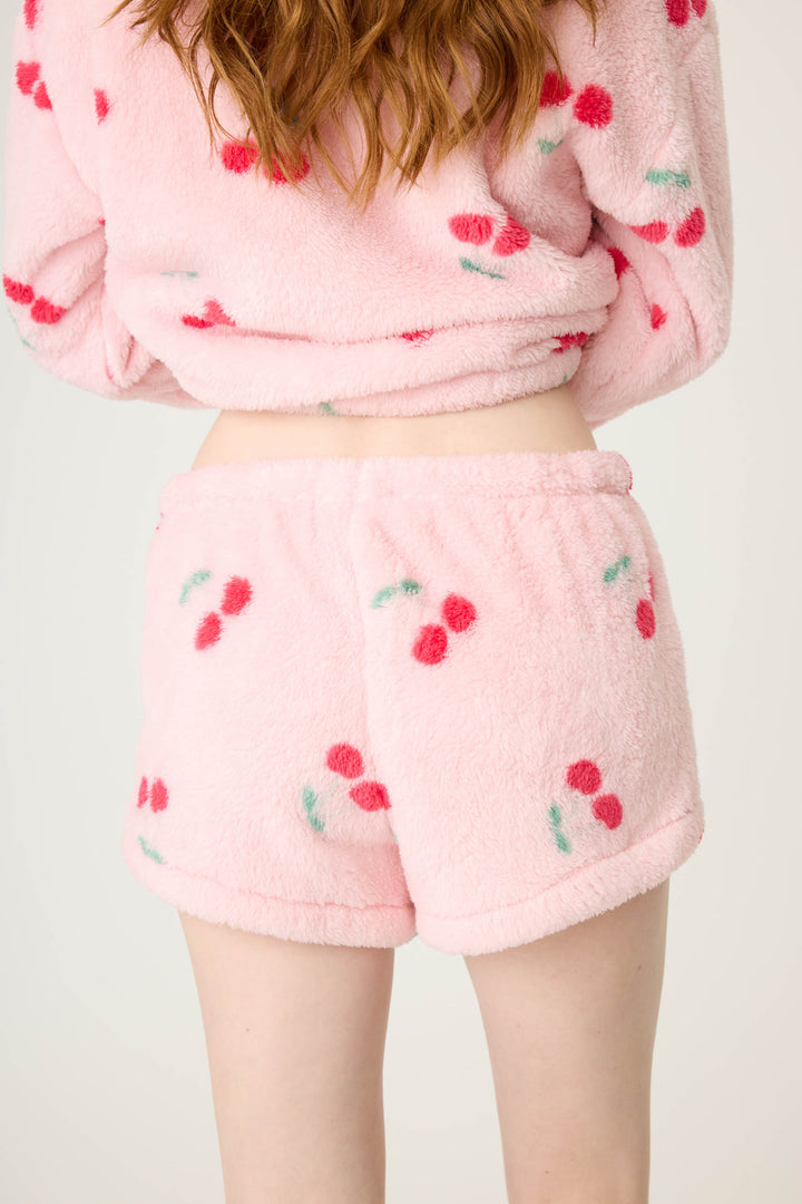 Women's pink fuzzy faux fur pj short with cherry pattern.