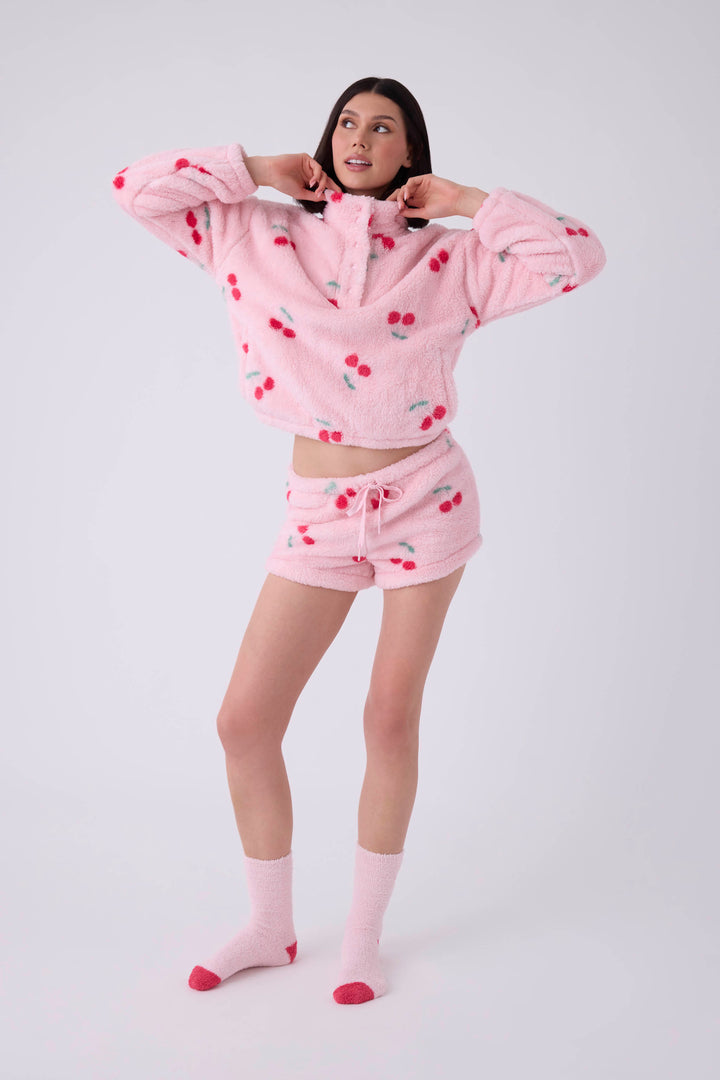 Women's pink fuzzy faux fur pj short with cherry pattern.