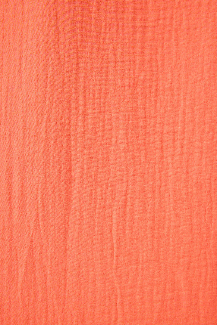 Women's red-orange lounge short in cotton woven gauze. Elastic waist with tie.