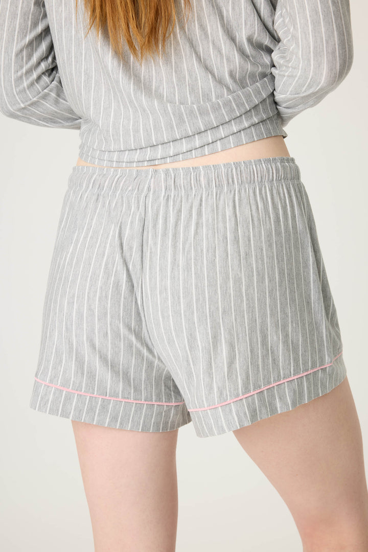 Grey-ivory pinstripe modal women's sleep short with pink piping contrast. Contrast tie waist.